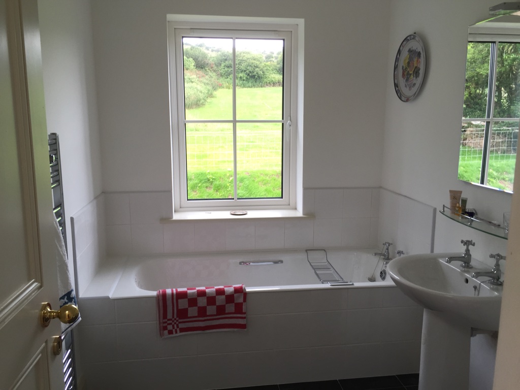 There are 4 decent sized bathrooms, 3 upstairs and one downstairs. The main upstairs bathroom has a cast iron bath and the other two have good sized showers. All the shower rooms and the bathroom are spacious, have electric heated towel rails and all have windows with views to the rear of the house.